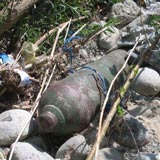 Garbage blocking a creek.