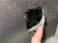 A hole in a screen.