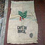 A coffee burlap bag with the writing "Cafe Do Brasil" on it.